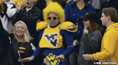 Man In Blue Yellow Costume With W Crowd GIF