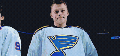 Man In Blues Jersey Next To Man With Number 9 GIF