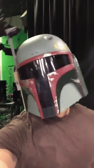 Man In Boba Fett Helmet Looking At Camera GIF