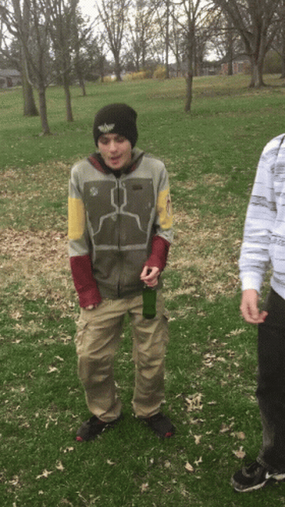Man In Boba Fett Jacket Holding Green Bottle GIF