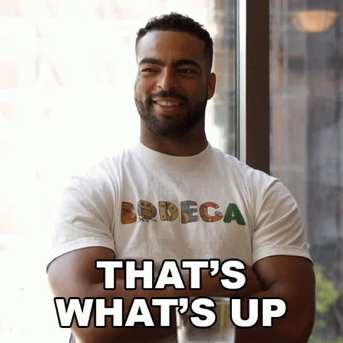 Man In Bodega T-Shirt Saying What's Up GIF