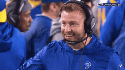 Man In Bose Headphones And Blue Jacket With Ram Logo GIF
