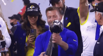 Man In Bose Headphones And Blue Jacket With Ram Logo GIF
