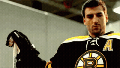 Man In Boston Bruins Jersey Holding Hockey Stick GIF