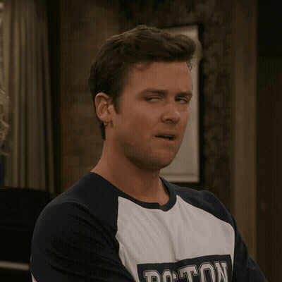 Man In Boston T-Shirt Looking Left GIF