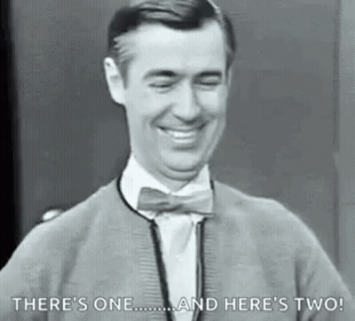Man In Bow Tie And Sweater Smiling Laughing GIF