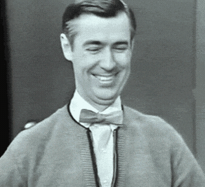 Man In Bow Tie And Sweater Smiling GIF