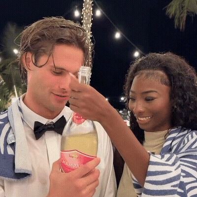 Man In Bow Tie Holding Love Island Champagne GIF
