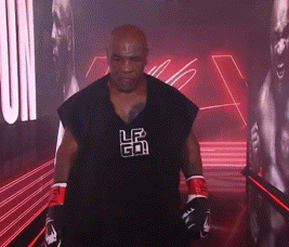 Man In Boxing Gloves And Black Shirt With LR GIF