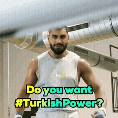 Man In Boxing Gloves In Front Of Do You Want #Turkishpower Sign GIF