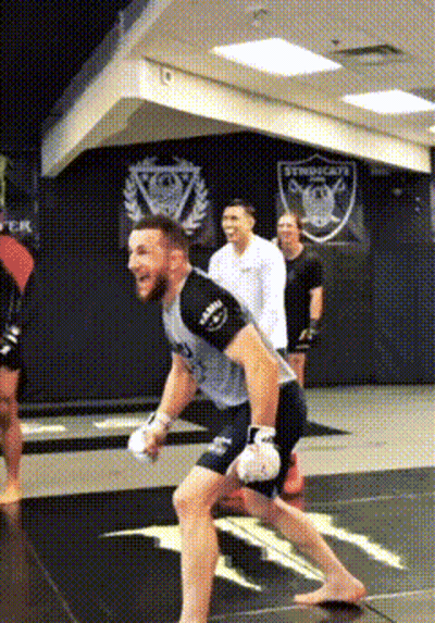 Man In Boxing Gloves Running On Gym Mat GIF
