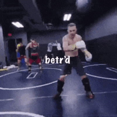 Man In Boxing Gloves Standing In Ring With Betr'd GIF
