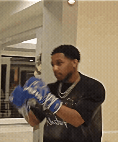 Man In Boxing Gloves With Victory Shirt GIF