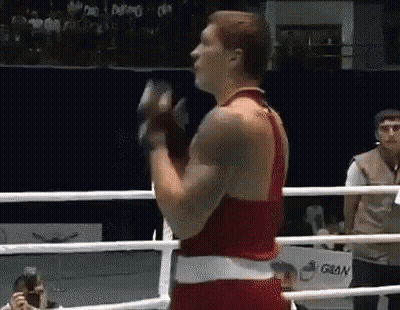Man In Boxing Ring Holding Glove GIF