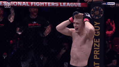 Man In Boxing Ring In Front Of OnlyFans Banner GIF
