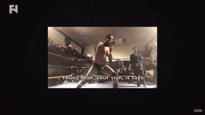 Man in Boxing Ring Saying Young Man Your Sign