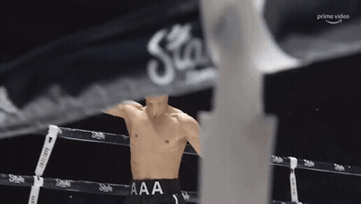 Man In Boxing Ring With AAA On Pants GIF