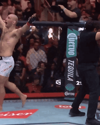 Man In Boxing Ring With Corona Tequila Sign GIF