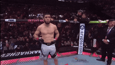 Man in Boxing Ring With Crypto.com Sign