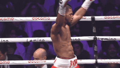 Man In Boxing Ring With Docomo On Ropes GIF