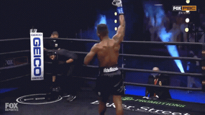 Man In Boxing Ring With Geico Sign GIF