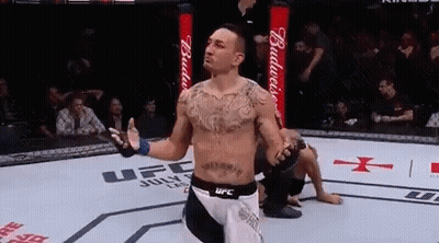 Man In Boxing Ring With Hands Up GIF