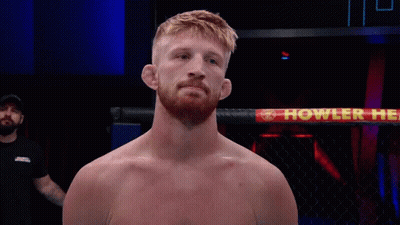 Man In Boxing Ring With Howler Sign GIF