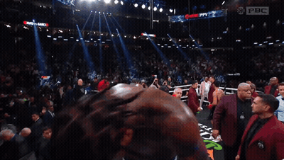 Man In Boxing Ring With PBC Sign GIF