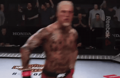 Man In Boxing Ring With Reebok On Wall GIF