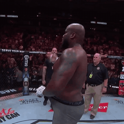 Man In Boxing Ring With Serve Your Way Sign GIF
