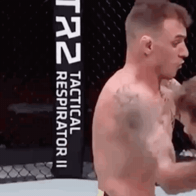 Man In Boxing Ring With Tactical Respirator II Sign GIF
