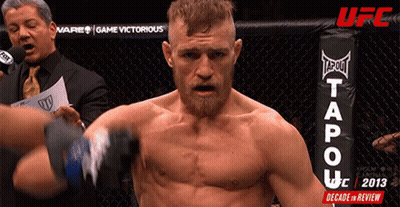 Man In Boxing Ring With Tapout Logo GIF