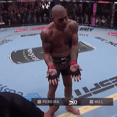 Man in Boxing Ring with UFC 300 Scoreboard
