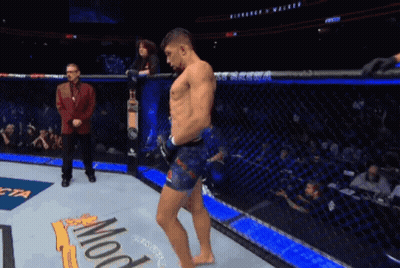 Man In Boxing Ring With UFC Arena Sign GIF