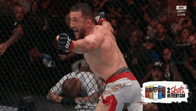 Man In Boxing Ring With UFC Gloves GIF