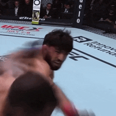 Man In Boxing Ring With UFC Sign GIF
