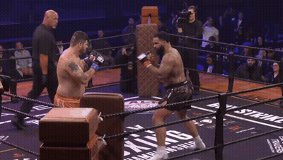Man In Boxing Ring With Word Skin On Ground GIF