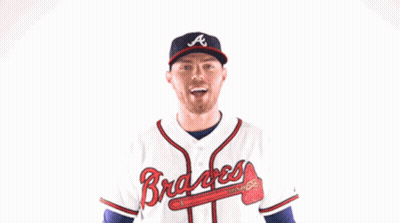 Man In Braves Jersey Flexing Arms GIF
