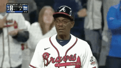 Man In Braves Uniform Standing In Dugout GIF