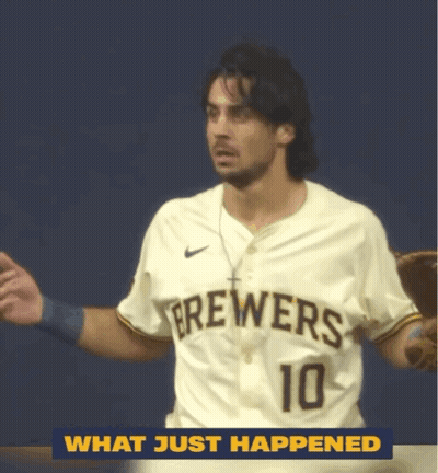 Man In Brewers Jersey Standing In Front Of Blue Wall GIF