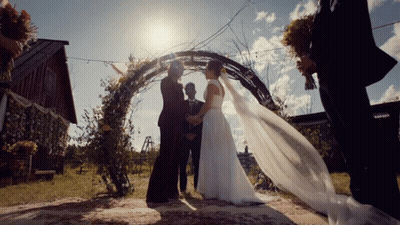 Man In Bride's Dress Looking In Mirror GIF
