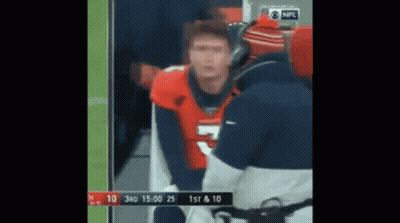 Man In Broncos Jersey Talking To Man In Blue Jacket GIF