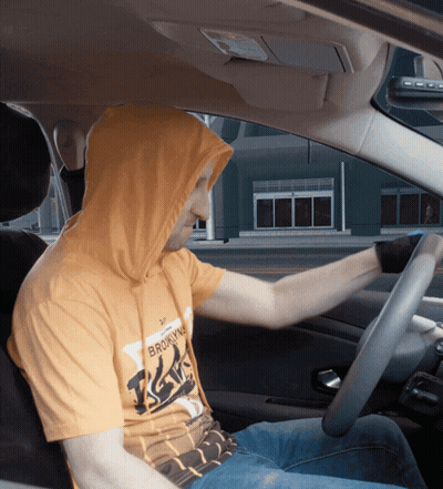 Man In Brooklyn Hoodie Sitting In Car GIF