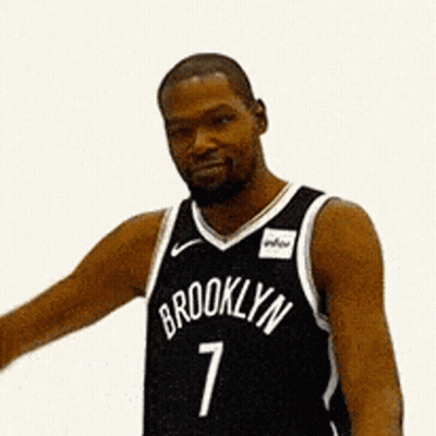 Man in Brooklyn Jersey Flexing Muscles