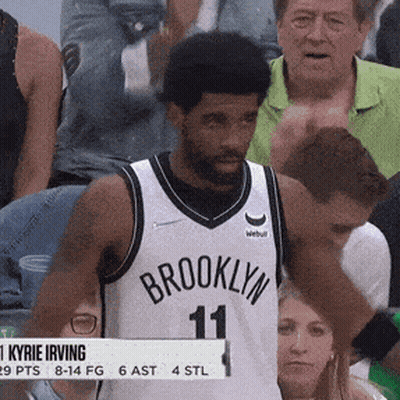 Man In Brooklyn Jersey Stands In Front Of Crowd GIF