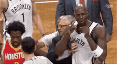 Man In Brooklyn Jersey Talking On Cell Phone GIF