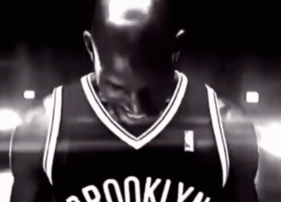 Man In Brooklyn Nets Jersey Smiling Black And White GIF