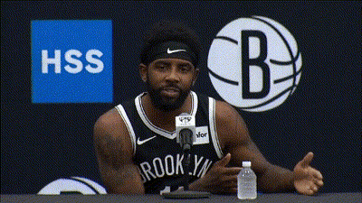 Man In Brooklyn Nets Jersey Talking Into Microphone GIF