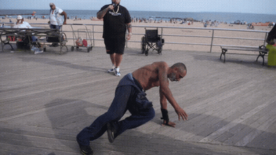 Man In Brooklyn Shirt Next To Man In Wheelchair GIF