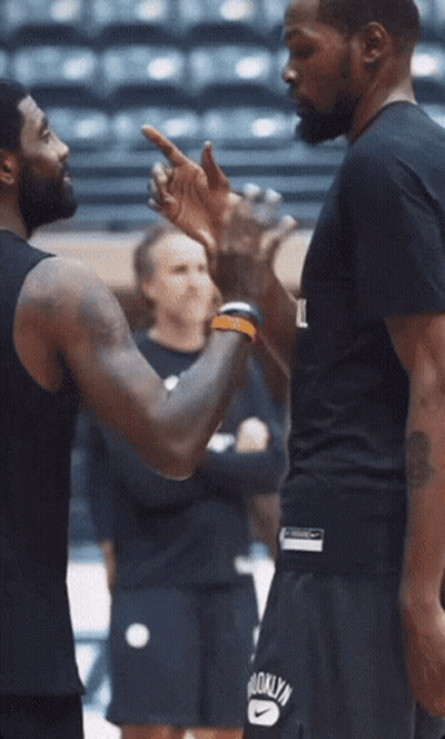 Man In Brooklyn Shirt Talking GIF